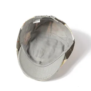 Detail view of the interior lining and wash label of the vintage plaid beret hat