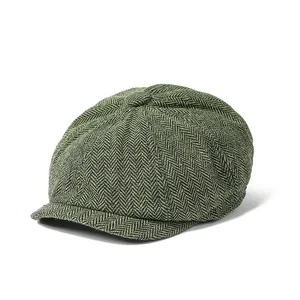 Classic green herringbone newsboy cap for men featuring a vintage wool blend texture