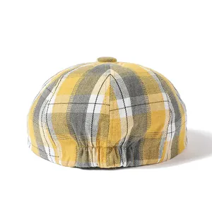British retro plaid newsboy cap in yellow and gray with elastic back adjustment