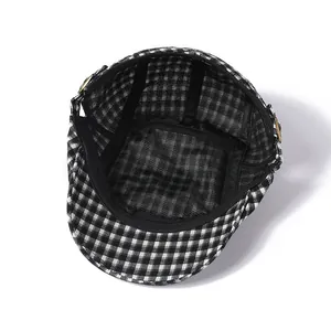 Classic checkered flat cap featuring vintage internal lining and metal side buckle