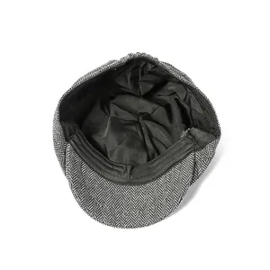 Detail of herringbone octagonal hat showing black fabric lining and precise inner stitching