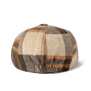 Classic checkered wool newsboy cap for men and women featuring warm vintage plaid patterns