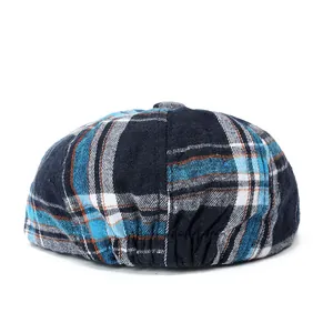 Classic plaid newsboy cap in navy and blue featuring a flexible elastic back strap