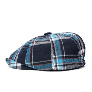 Detail view of the vintage plaid newsboy cap featuring high-quality blue textured fabric