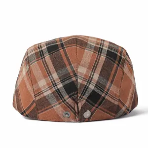 Classic brown plaid newsboy cap with vintage checkered pattern and side metal buckle buttons