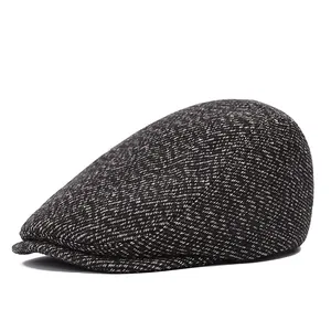 Men's winter flat cap in brown tweed fabric with warm thick texture and vintage style