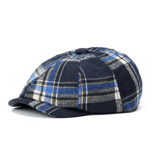 Close-up of blue and yellow plaid newsboy hat showing fine wool texture and stitch details
