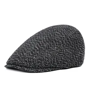 Thick warm winter newsboy hat for men in black and white tweed wool texture