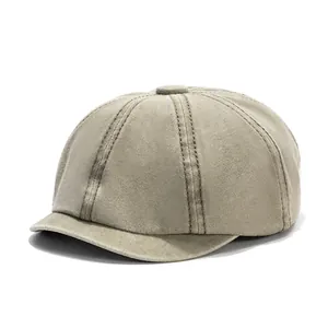 Vintage washed khaki cotton newsboy cap with short brim and six-panel octagonal design
