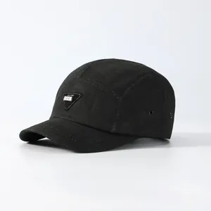 Unisex black short brim five-panel camper hat with metal logo and breathable vents