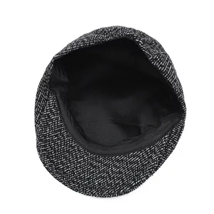 Detailed view of winter thick warm newsboy cap with black and white twill and inner lining
