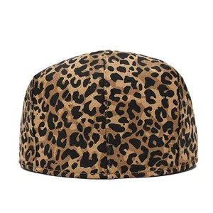 Detail of leopard print cotton beret with fine stitching and rounded silhouette