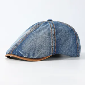 Vintage blue denim beret with brown leather brim and contrast stitching details