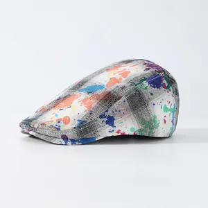 Vintage flat cap with colorful graffiti print over a classic grey checked pattern fabric