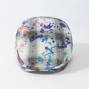Artistic graffiti beret with black and white plaid pattern and colorful paint splatters