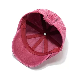Detail of red cotton octagonal cap interior with reinforced seams and elastic band