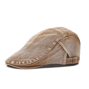 Vintage brown washed denim newsboy cap with adjustable metal buckle on white background