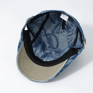 Detailansicht der Denim-Blumenkappe innen mit 100% Baumwoll-Etikett und Schweißband