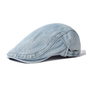 Light blue washed denim flat cap with adjustable brass buckle for women