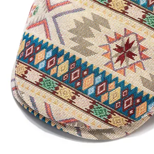 Close-up of bohemian geometric jacquard weave on a vintage ethnic style beret hat