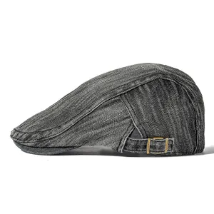 Vintage washed denim beret with adjustable gold metal buckle shown from side profile