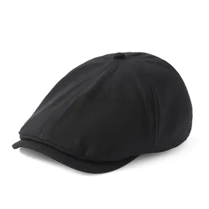 Béret rétro noir en coton de style britannique au design épuré et monochrome