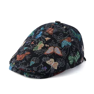 Retro black jacquard newsboy cap with colorful butterfly patterns on white background