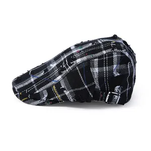 Retro distressed plaid newsboy cap with colorful stitching and adjustable silver buckle