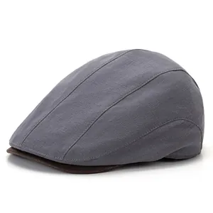 Cappello newsboy retrò classico britannico in tessuto grigio con tesa marrone per uomo e donna