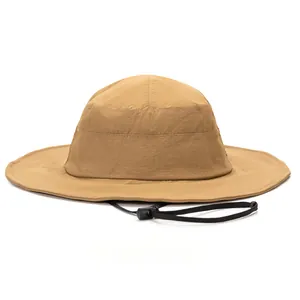 Detail of khaki wide brim sun hat showing lightweight fabric and adjustable wind cord