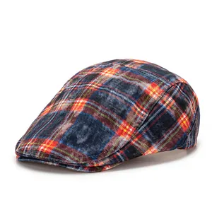 Close-up of navy blue newsboy cap with classic red and yellow plaid patterns