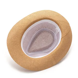 Detailed interior of the paper straw hat showing the inner lining and size 58cm tag