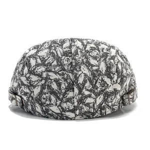 Close-up of textured fabric pattern and brass buckle on a vintage docker hat