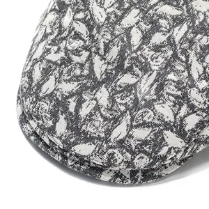 Close-up of the black and white leaf pattern woven fabric on this stylish beret hat