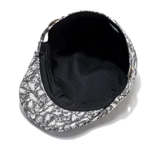 Inside view of a retro flat cap with black lining and artistic pattern