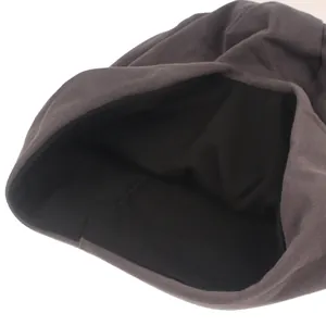 Close-up of double-layer knitted beanie showing grey outer fabric and black fleece lining