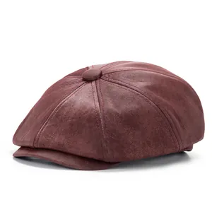 Vintage burgundy newsboy cap with distressed leather texture and eight-panel crown design
