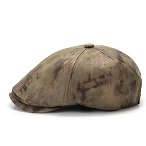 Detailed macro view showing vintage distressed fabric texture on the retro newsboy cap