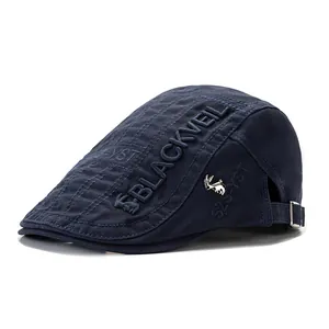 Detail of navy cotton beret with BLACKVEIL embroidery and metal rabbit pin badge