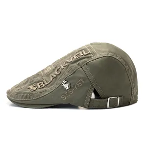 Detail of army green military cap with black embroidery and silver rabbit emblem