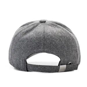 Back view of grey wool baseball cap showing adjustable metal buckle and warm fabric texture