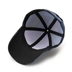 Detail of baseball cap interior showing breathable grey mesh lining and reinforced taping