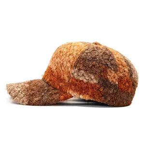 Close-up of color-block plaid teddy fleece baseball cap with warm autumn tones