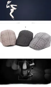 Detailed close-up of vintage cotton plaid newsboy caps in brown and grey color variants