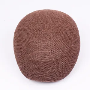 Top view of brown woven mesh beret showing the detailed breathable spiral knit texture