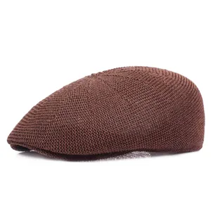 Detail of dark coffee mesh knit ivy cap showing breathable texture and woven visor
