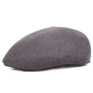 Detail of dark grey breathable mesh fabric and texture on the flat cap for men