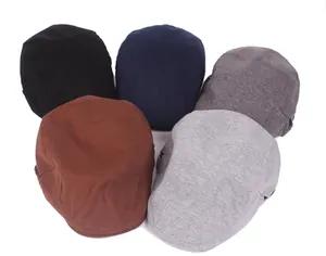 Flat caps collection in black, navy, brown, and grey with textured fabric detail