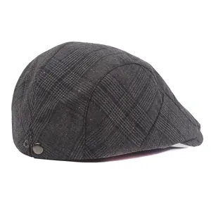 Dark grey houndstooth flat cap in vintage British style with side metal buckle detail