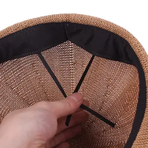 Internal view of breathable woven straw hat showing the adjustable drawstring and sweatband